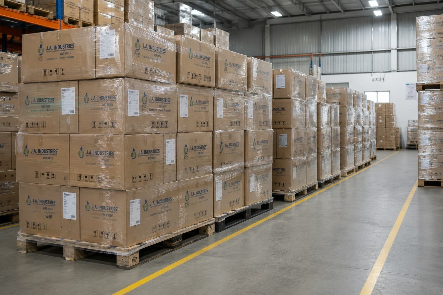 Warehouse stacked with cartons of finished J.A. Industries wet wipes ready for dispatch